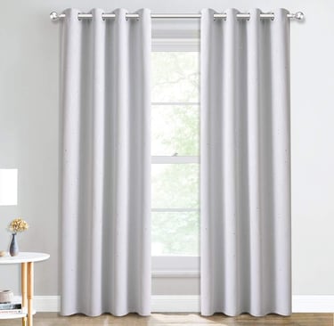 a curtain with a curtain in a room