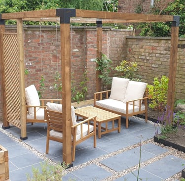 A Pergola with seats under it from a garden design by the intrinsic link
