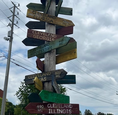 Pole with many different signs on it