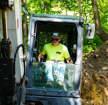 Patrick Kruse, Owner of Kruse Contracting, digging in an excavator