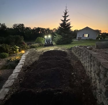 skid-steer-spreading-dirt-for-landscaping-project.jpg