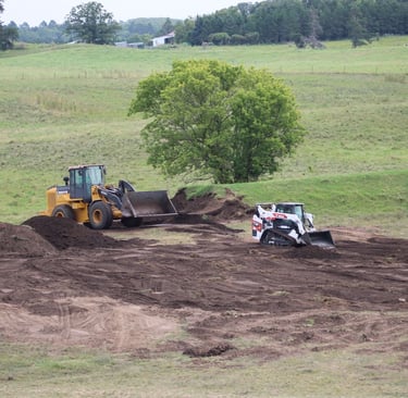 skid steer moving dirt