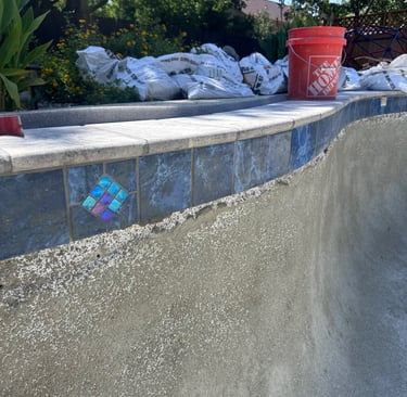 New tile installed on a pool during a remodel
