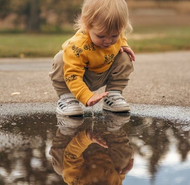 little boy playing in a paddle