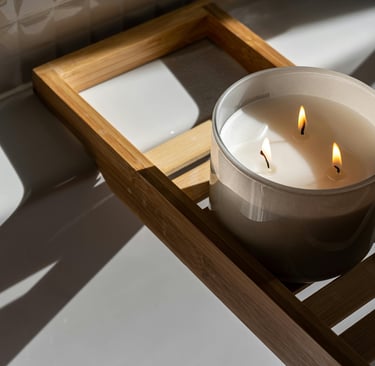3 wick candle on wooden bath tray
