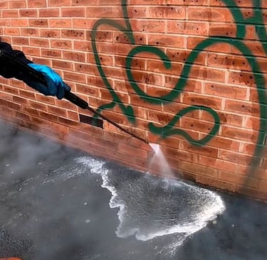 Graffiti removal with hot water pressure washing in Renton, WA