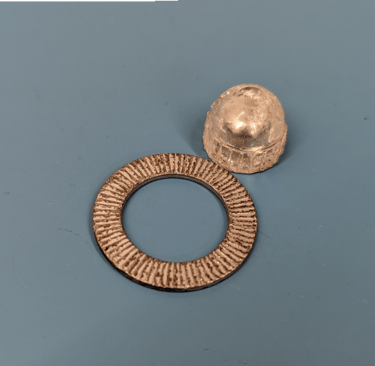 a metal object with a ring on it
