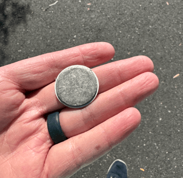 a person holding a coin with a coin