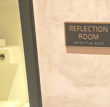 Reflection room sign at Chase Sapphire Lounge JFK Terminal 4 with room entrance visable