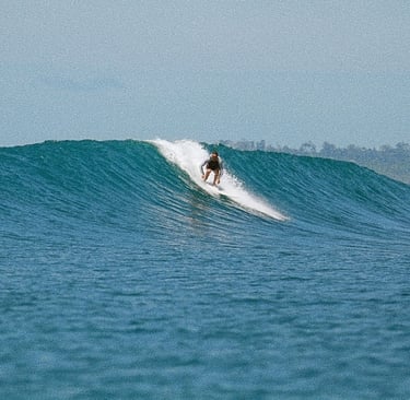 a person riding a surfboard in the ocean