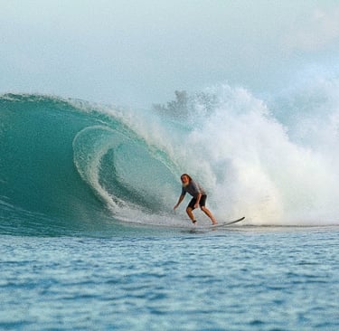 a surfer is riding a wave in the ocean