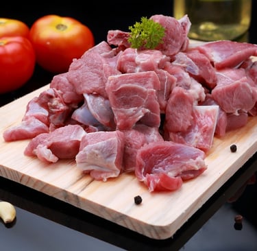 Fresh raw goat mutton on wooden board - high quality meat from Mutton Lovers.