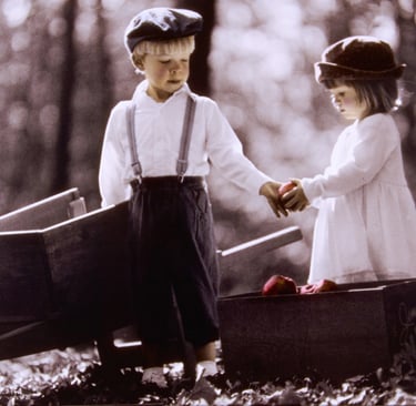 vintage photo of a boy and girl holding hands and holding apples