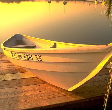 a boat on a dock with a boat in the water