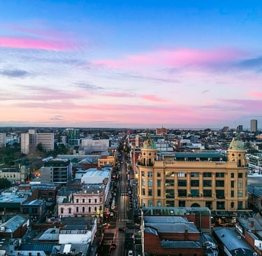 A drone image looking south down Chapel Street Precinct at sunrise