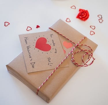 A card with a heart on it, on wrapped gift