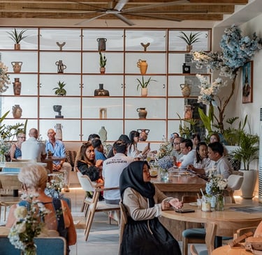 Inside Uma Blu Coffee & Brunch with customers
