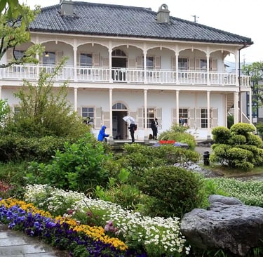 Former Mitsubishi No. 2 Dock House in Nagasaki, a historic Western-style building overlooking the ha