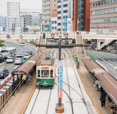 A streetcar running through Nagasaki city, a popular way to travel between major sightseeing spots