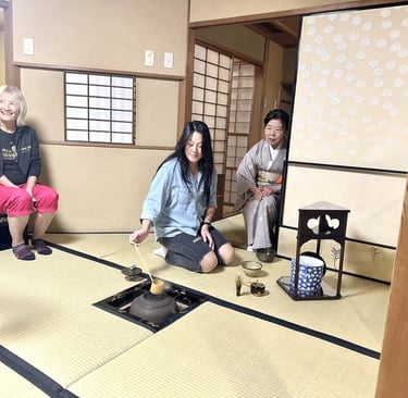 Woman experiencing a traditional tea ceremony in Nagasaki