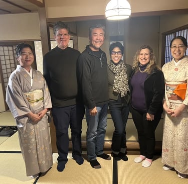 Guests taking a photo with the tea ceremony master in Nagasaki