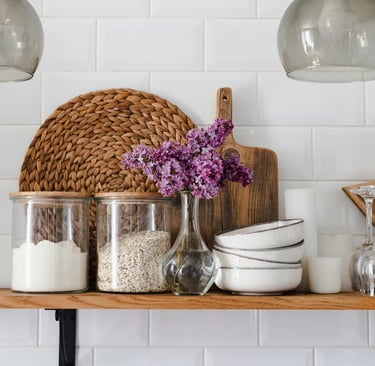 Calm, organized home interior with decluttered shelves and styled accessories