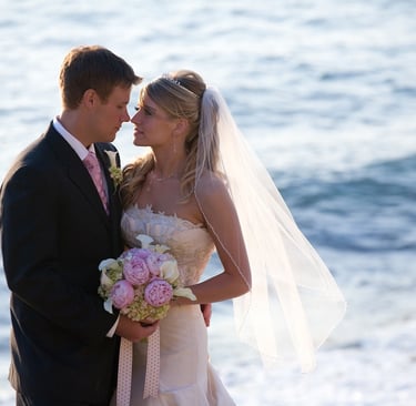 Bride holding pink and white wedidng bouquet with groom at cuvier park, la jolla