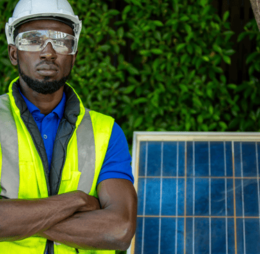 a man in a safety vest and safety glasses