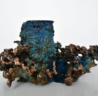 Photographie d'un bougeoir en bronze représentant des coraux