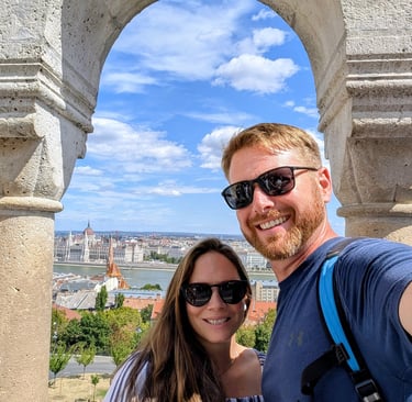 Don and Samantha in front a panoramic view from Fisherman's Bastion in Budapest, Hungary