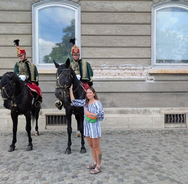 Samantha petting a Hungarian Royal guard horse at Castle Hill in Budapest, Hungary