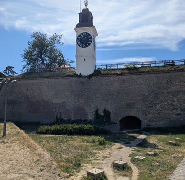 Petrovaradin Fortress clocktower standing on top of a stone wall near Novi Sad, Serbia.