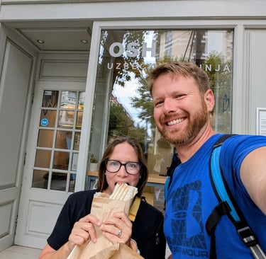 Don and Samantha eatting a plove wrap outside Osh restaurant Belgrade serbia