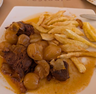 veal stafado with French frys at The Octopus Restaurant in Mithymna Greece