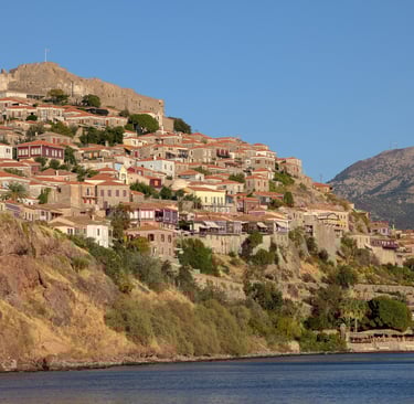 view of Molyvos Castle from across  the Aegean Sea in Mithymna, Greece