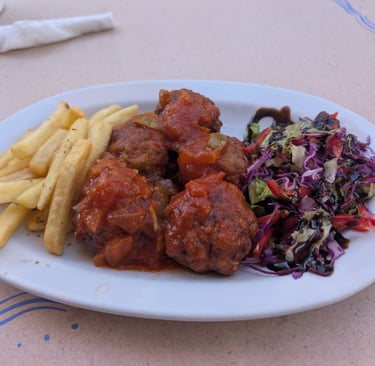 greek meatballs with french frys and salad from Cafe Tavern Costas in Petra, Greece
