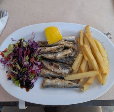 fried sardines with french frys and asaladfrom Cafe Tavern Costas in Petra, Greec