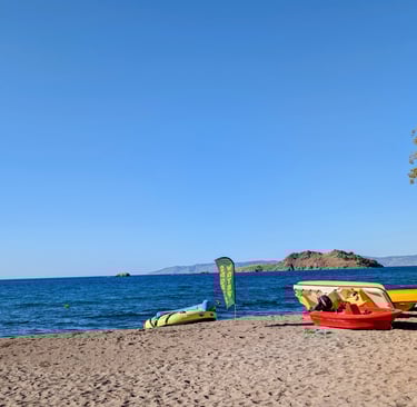Sandy Beach on the Agaean  Sea with boats for rent on Parlia Anaxos Beach in Petra Greece