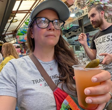 Samantha drinking pickle juice in the Kemeraltu Bazaar in Izmir, Turkey