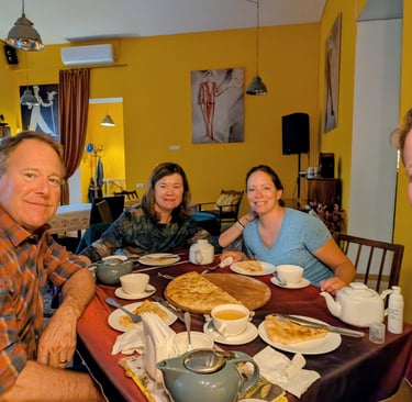 family enjoying tea and khachapuri at Tea House Foe-Foe in Kutaisi Georgia
