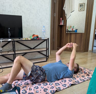 don laying on the floor in the livingroom  Apartment 16 in Tbilisi Georgia 