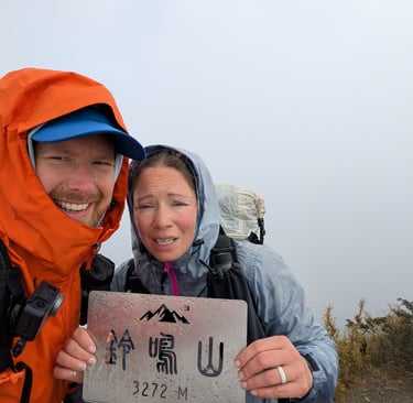don and samantha on the summit of lingming moutain in the central range of taiwan