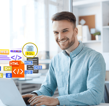 a man sitting at a table with a laptop as a freelance web designer