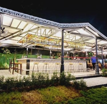 a restaurant with a large glass roof and a long table