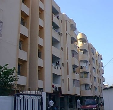 a building with a lot of windows and a lot of people walking by