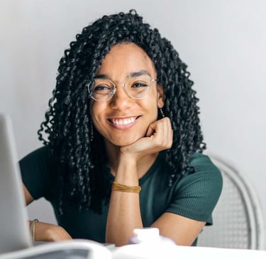 Pleased female patient near laptop computer