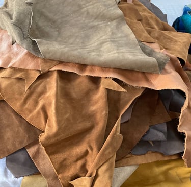 light coloured off cut pieces of suede 