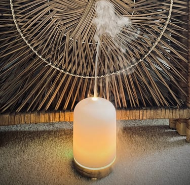 Diffuser giving off steam in front of a bamboo screen