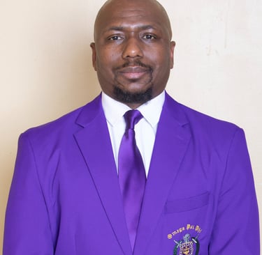 a man in a purple suit and tie