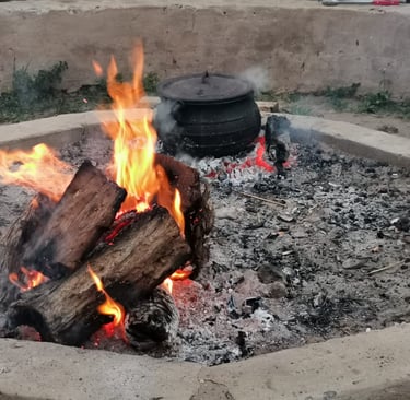 Hiking Shack Firepit with black pot cooking